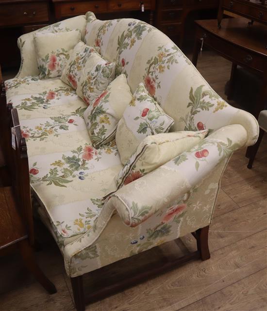 A near pair of George III style mahogany camel-back settees larger W.220cm